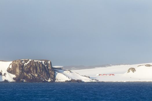 snowy cliff and sea