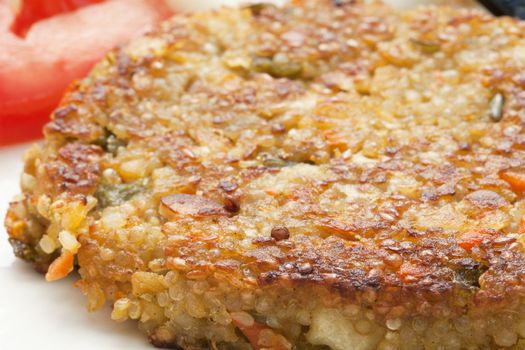Closeup of  a vegetarian quinoa burger.