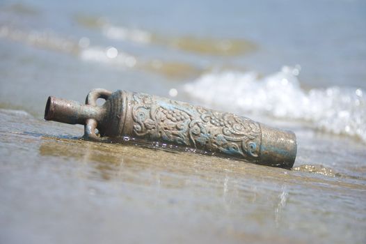 amphora in the sand on the beach