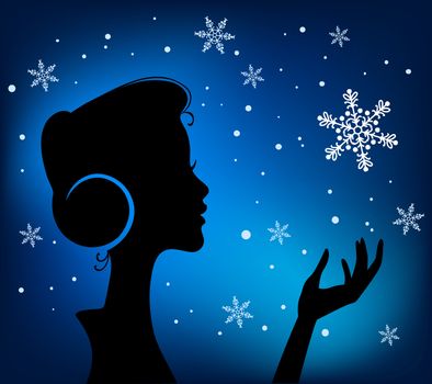 Christmas Eve background. Profile Silhouette of Pretty Young Girl Listening to Song Melody in Headphones with Snowflake in her Hand. Image May Be Use as Postcard or Placard