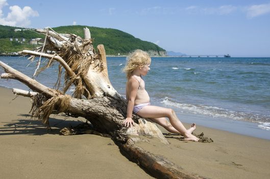 little girl on the bank of the Sea