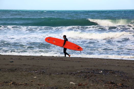Surfer on the beach, Levanto.