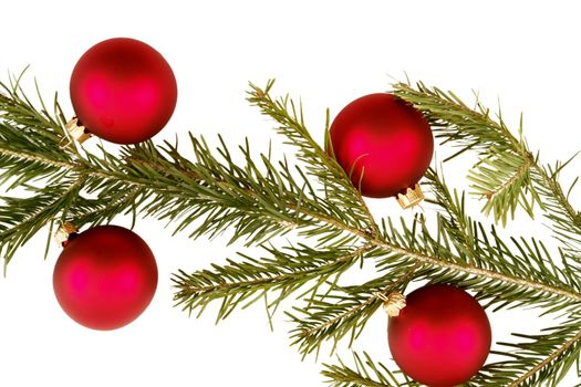 Border of red christmas garland with baubles and ribbons on white.