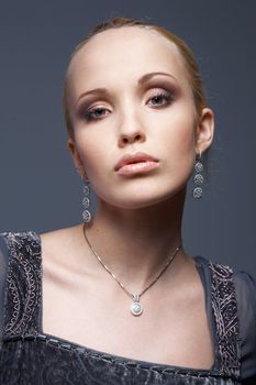 Close-up portrait of a model with vintage jewellery.