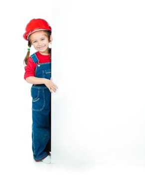 cute little girl in the construction helmet with a white board