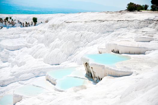 Beautiful blue travertine pools and terraces in Pamukkale Turkey