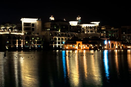 beautiful view in dubai city at night with reflections in water