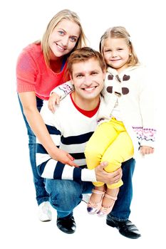 Portrait of happy parents with their daughter looking at camera