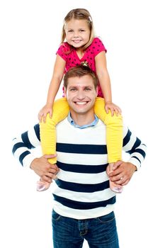 Fun loving kid in bright colored dress sitting on her father's shoulders