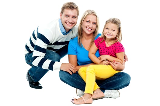 Portrait of happy couple smiling with cute daughter isolated against white background