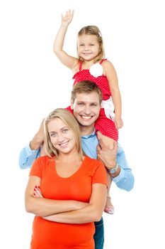 Happy family of three members standing in embrace. Cute daughter enjoying piggy ride