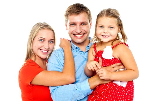 Family of three, mother and daughter on sides and father in center