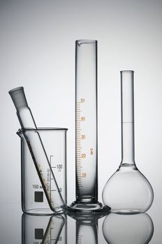 Chemical flasks over white background