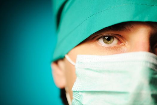 Surgeon in mask close-up portrait