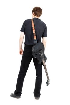 A young man with a black electric guitar isolated on white background