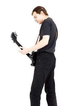 A young man with a black electric guitar isolated on white background