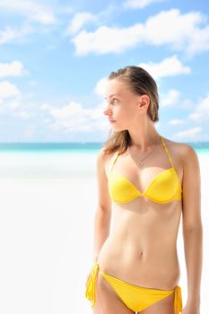 Woman with  beautiful body on a tropical beach