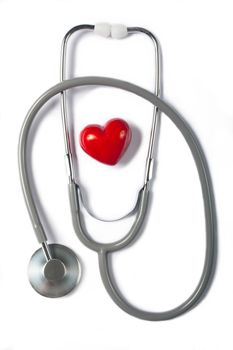 Stethoscope & red heart on white background