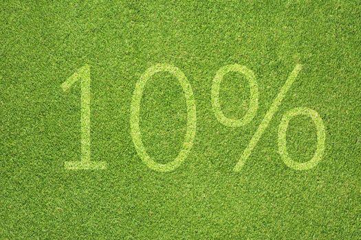 Percent icon on green grass texture and background 