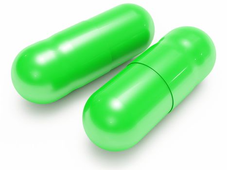 Two shiny green pills (medical capsules) on white background