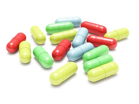 Many colored pills isolated on white background
