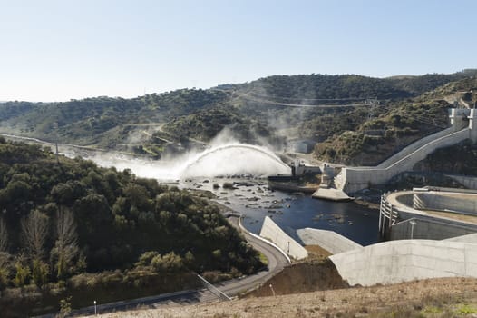 Jet of water from spillway overflow in the Alqueva dam, Guadiana river, Alentejo, Portugal