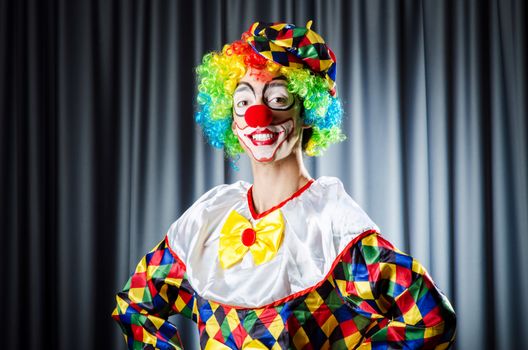 Funny clown in the studio shooting