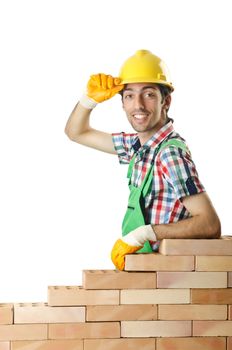 Builder with hard hat on white