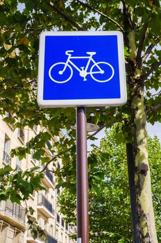 Bicycle sign on blue background