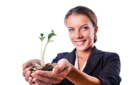 Businesswoman with seedling on white