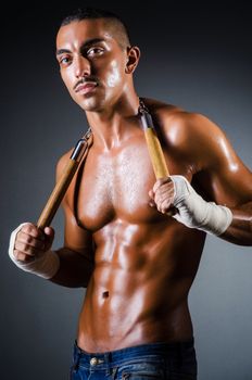 Strong man with nunchaku