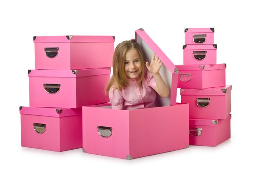 Little cute girl with lots of boxes