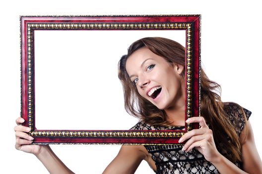 Young woman with picture frame on white