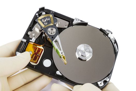 technician with open hard-disk in light background