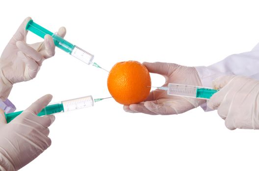 Science experiment with orange and syringe
