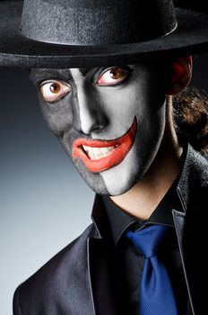 Businessman with clown face paint
