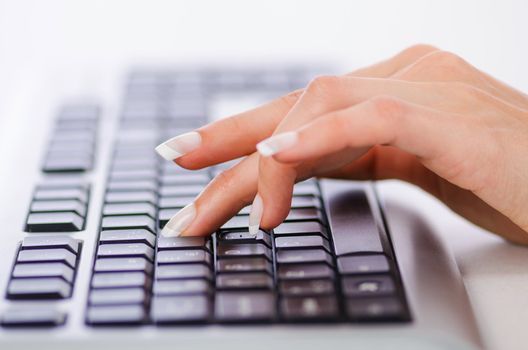 Hands working on the keyboard