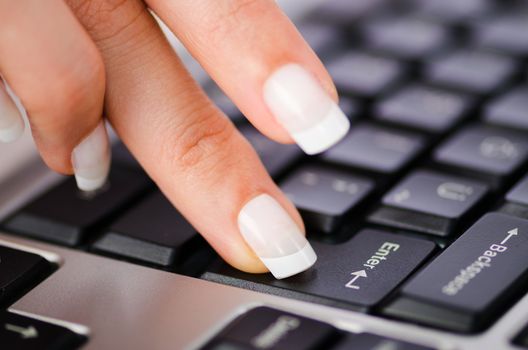 Hands working on the keyboard