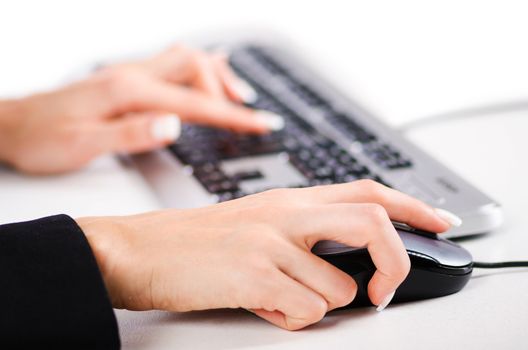 Hands working on the keyboard