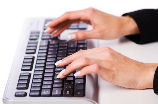 Hands working on the keyboard