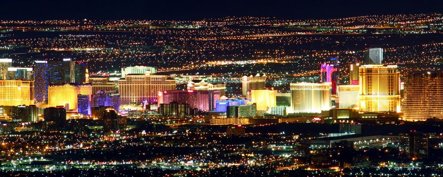 Las Vegas, USA - November 26, 2011: Bright lights of hotels and casinos of the Las Vegas Strip. The Strip is about 4 miles long and is seen here from the Frenchman Mountain summit.