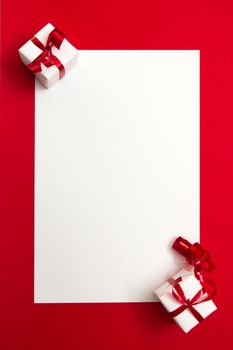 Two wrapped gifts represent christmas theme, with a blank white card for text