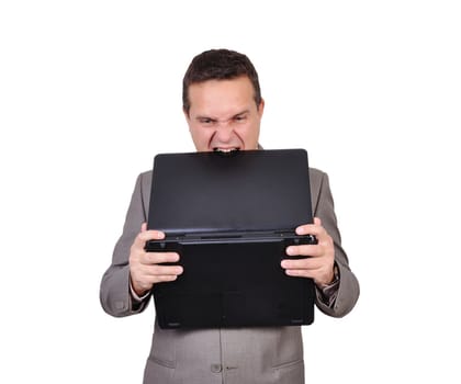 angry businessman biting the laptop