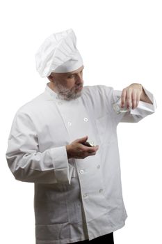 Portrait of a caucasian chef in his uniform on a white background.