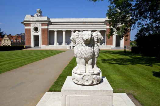 A monument/memorial dedicated to the Indian servicemen who fought in Flanders fields during the first world war.  Behind the monument is the Menin Gate.