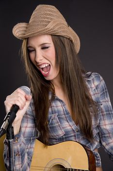 A western girl belts out a tune