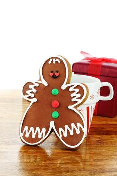 Gingerbread man cookie has been set out for Santa with a cup of milk. Copyspace available.