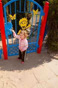 Having fun playing on playground on sunny morning.