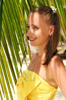 Woman on beautiful beach with palm trees at Philippines