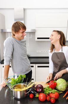 Couple cooking in modern kitchen